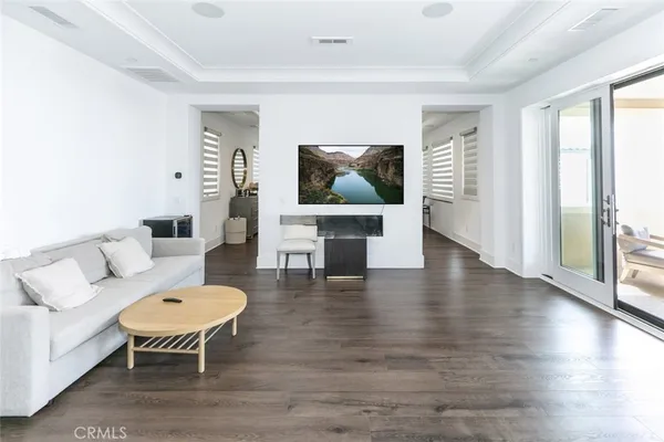a large white kitchen with a sink and cabinets