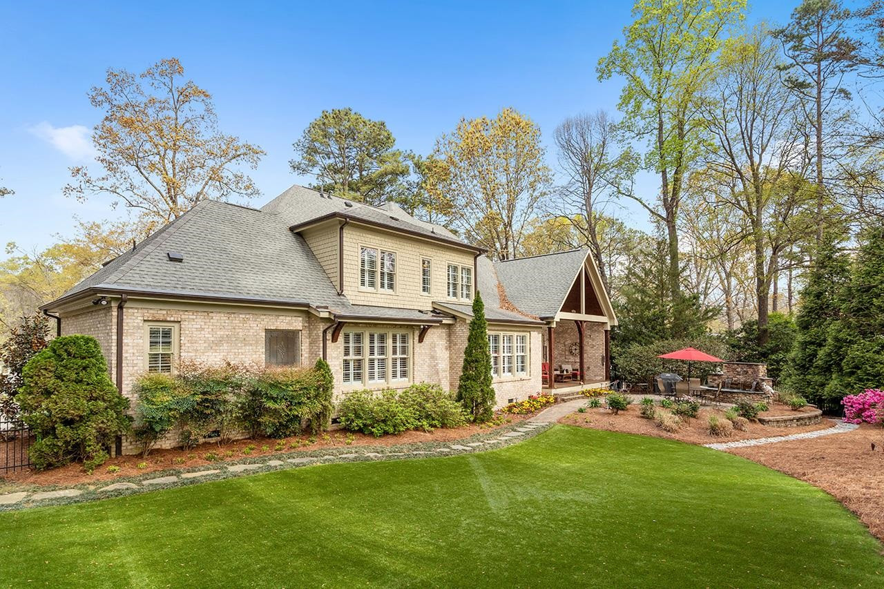 1116 Hunting Ridge Road Raleigh, NC 27615 - Photo 12 of 91 a view of a big yard with plants and a large tree