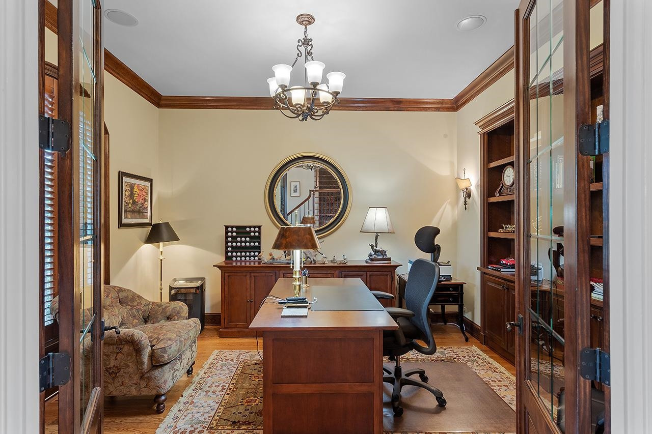 1116 Hunting Ridge Road Raleigh, NC 27615 - Photo 20 of 91 a view of living room with furniture and a chandelier