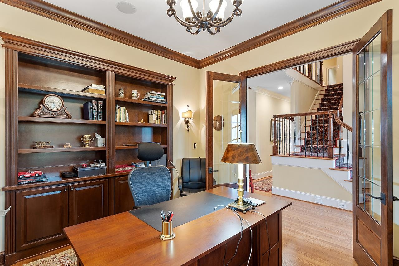 1116 Hunting Ridge Road Raleigh, NC 27615 - Photo 21 of 91 a view of a dining room with furniture and a chandelier