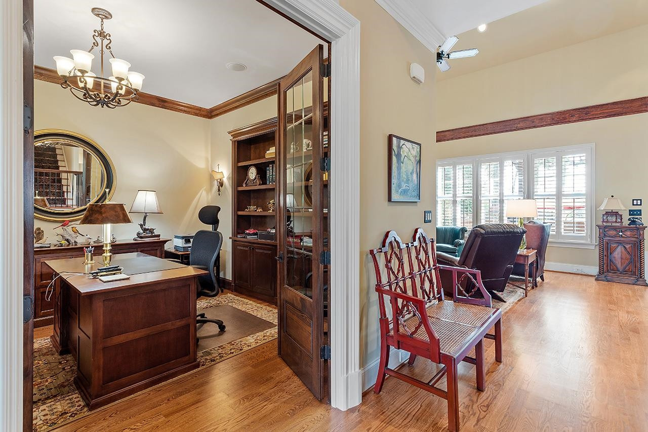 1116 Hunting Ridge Road Raleigh, NC 27615 - Photo 24 of 91 a view of a dining room with furniture window and wooden floor