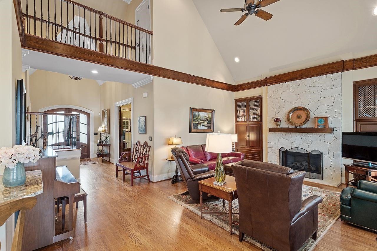 1116 Hunting Ridge Road Raleigh, NC 27615 - Photo 26 of 91 a living room with furniture a fireplace and a flat screen tv