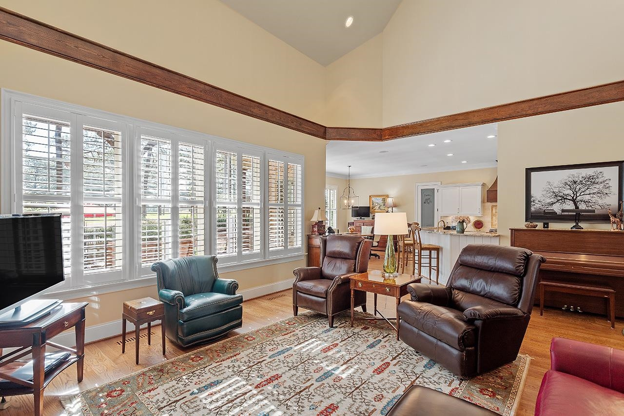 1116 Hunting Ridge Road Raleigh, NC 27615 - Photo 29 of 91 a living room with furniture and a flat screen tv