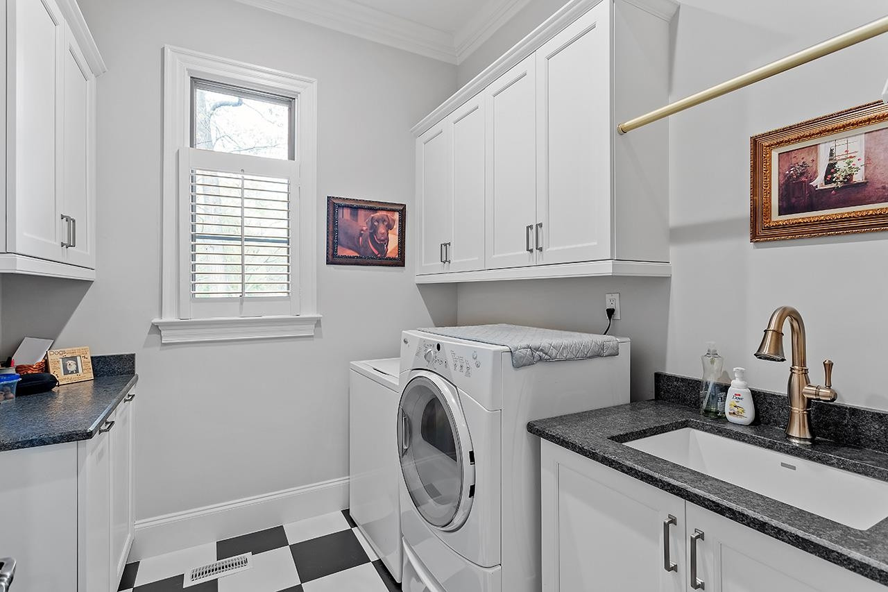 1116 Hunting Ridge Road Raleigh, NC 27615 - Photo 40 of 91 a utility room with sink dryer and washer