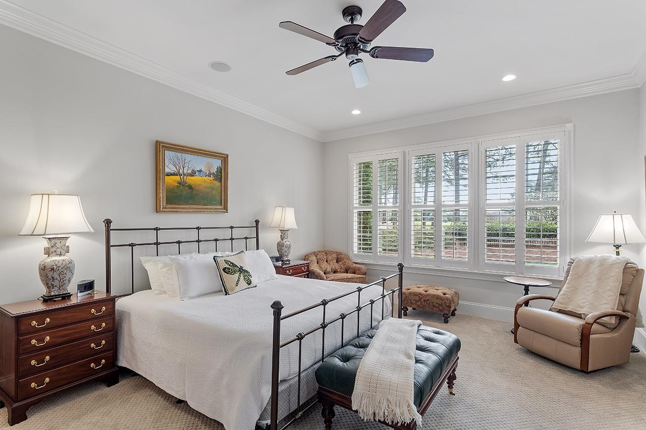 1116 Hunting Ridge Road Raleigh, NC 27615 - Photo 46 of 91 a bedroom with furniture and a large window