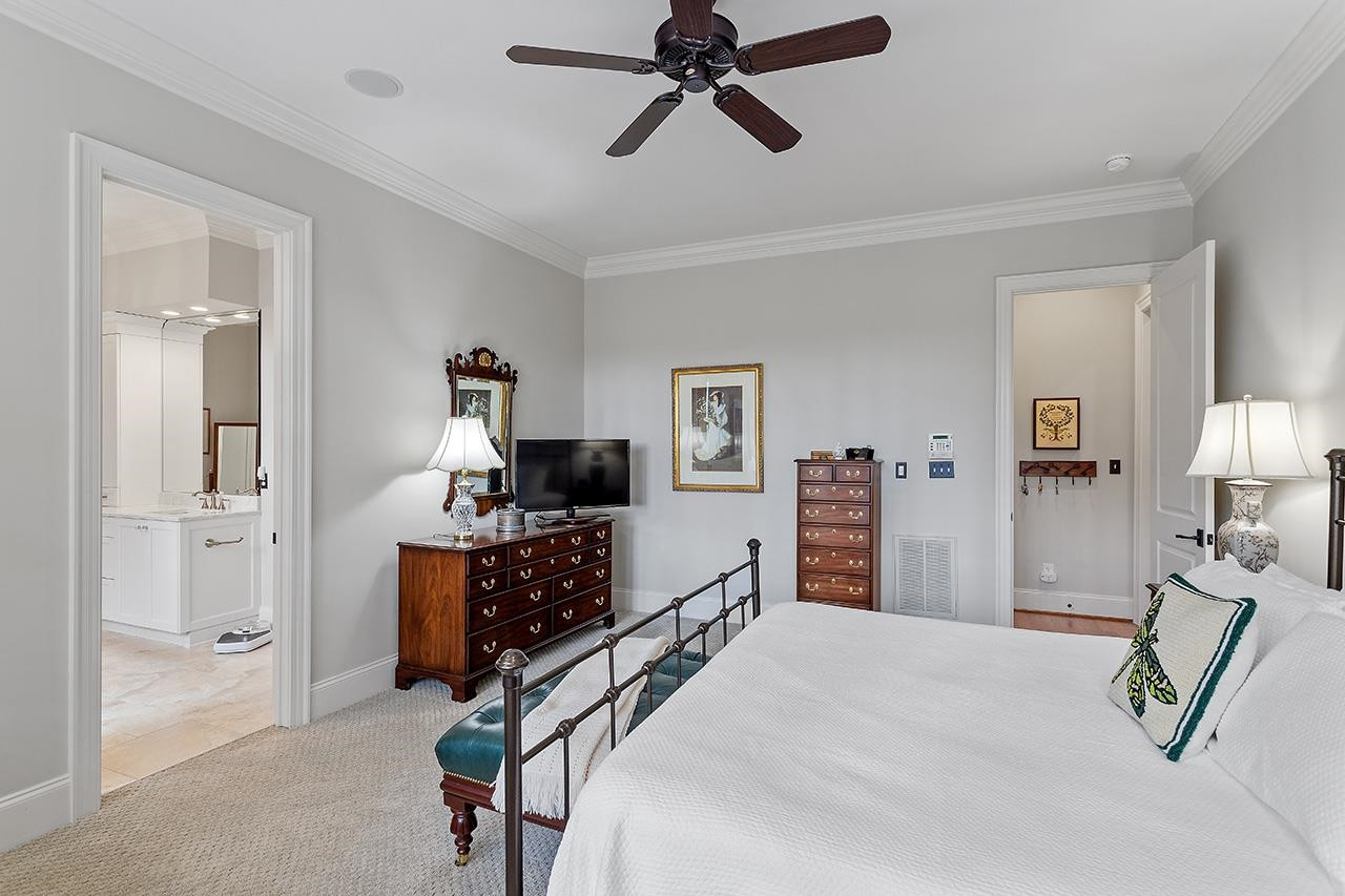 1116 Hunting Ridge Road Raleigh, NC 27615 - Photo 47 of 91 a bedroom with furniture and a wooden floor