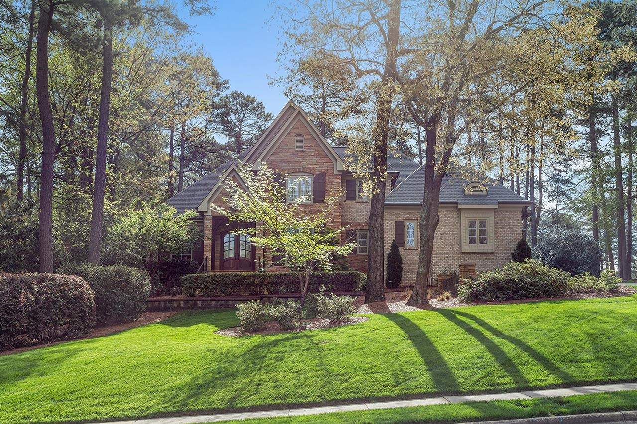 1116 Hunting Ridge Road Raleigh, NC 27615 - Photo 5 of 91 a front view of a house with a yard
