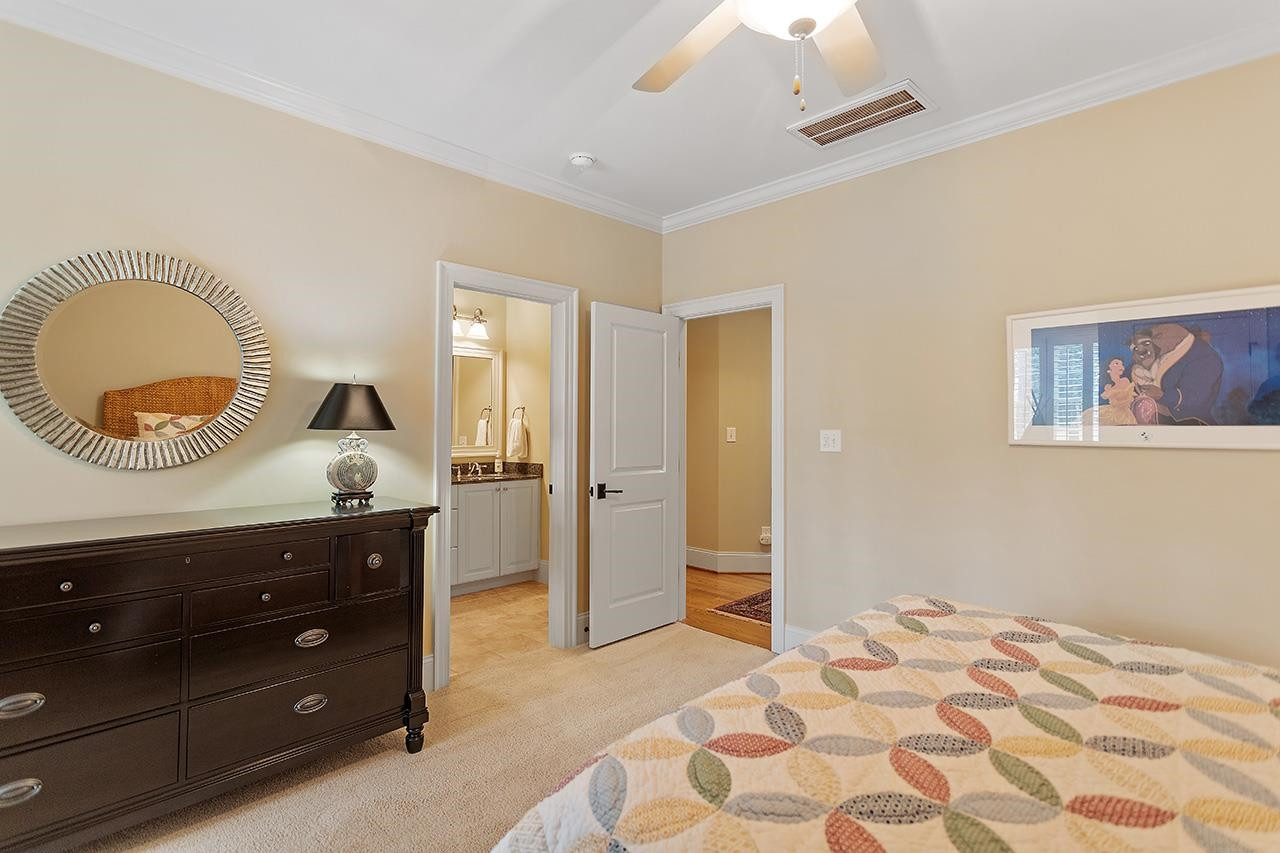 1116 Hunting Ridge Road Raleigh, NC 27615 - Photo 57 of 91 a bedroom with a bed and a dresser