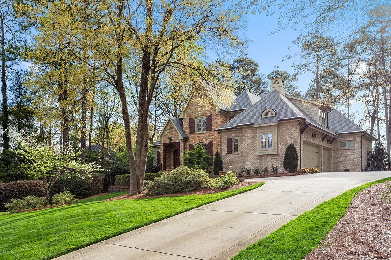 1116 Hunting Ridge Road Raleigh, NC 27615 - Photo 6 of 91 a front view of a house with a yard