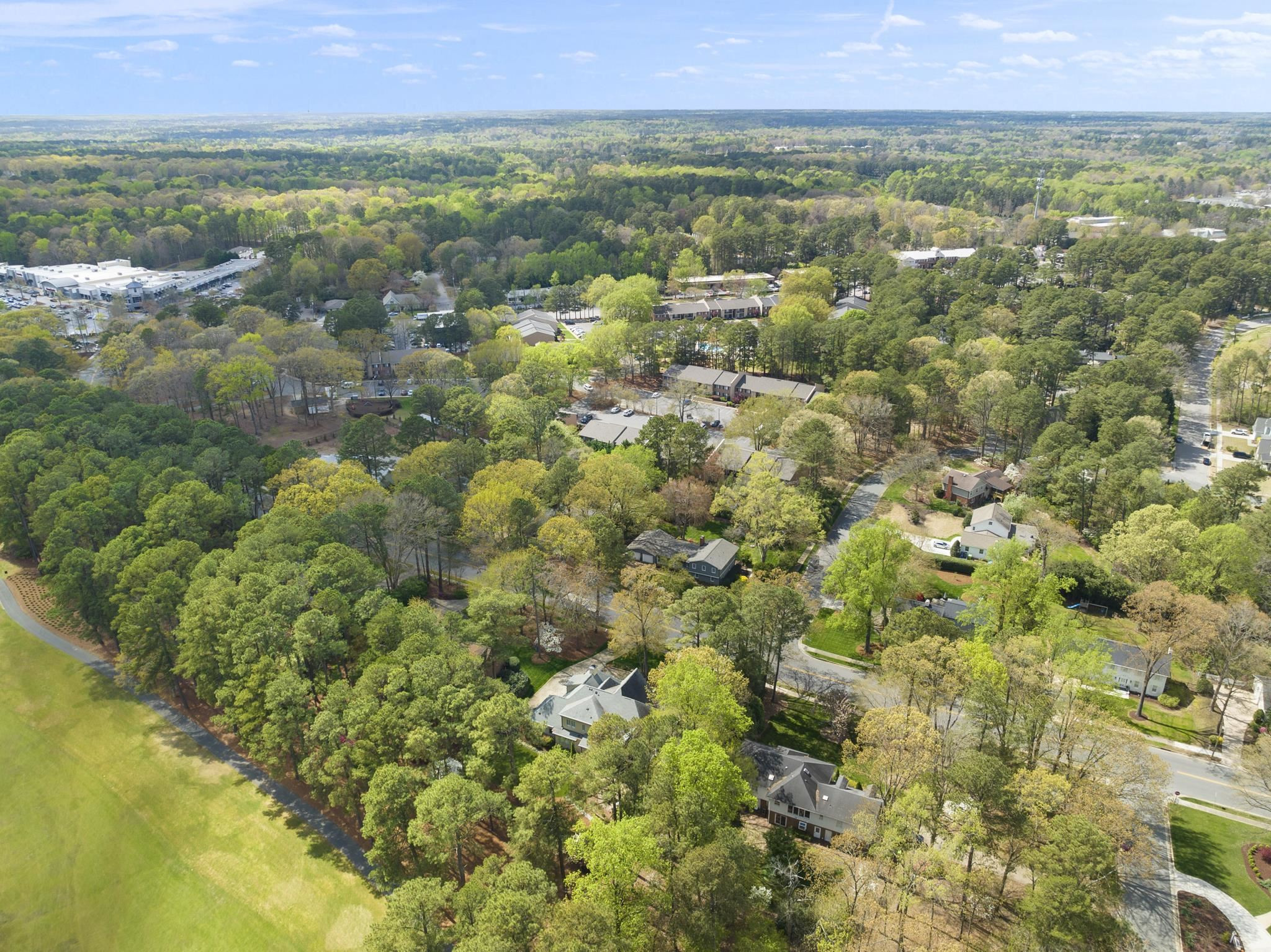1116 Hunting Ridge Road Raleigh, NC 27615 - Photo 71 of 91 a view of a city with lush green forest