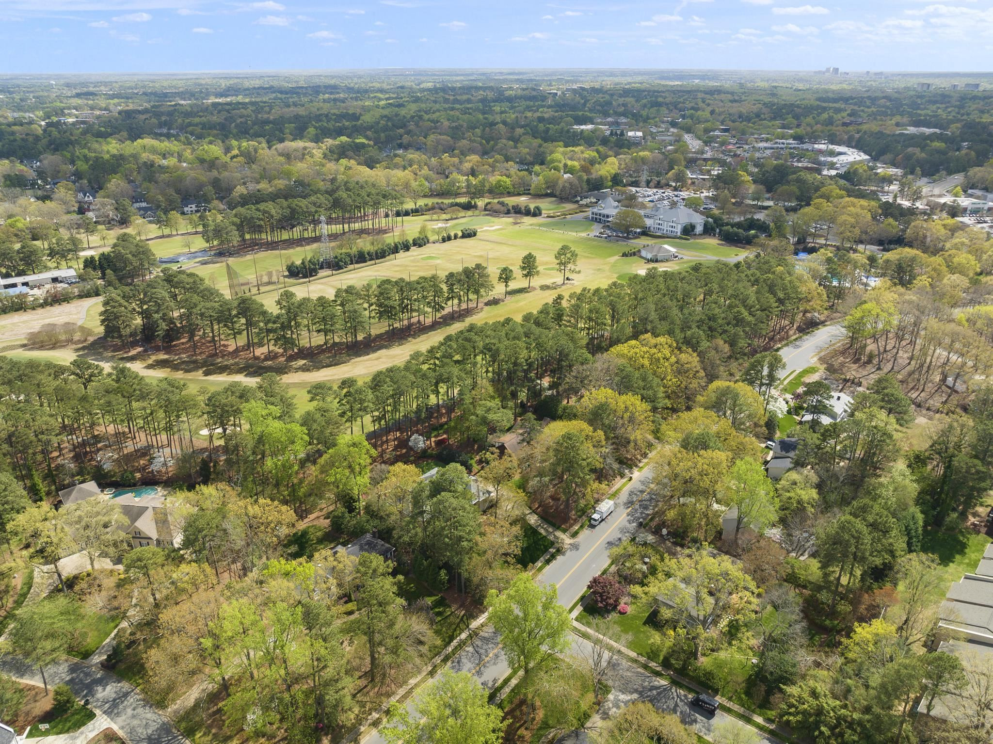 1116 Hunting Ridge Road Raleigh, NC 27615 - Photo 79 of 91 an aerial view of residential houses with outdoor space and trees
