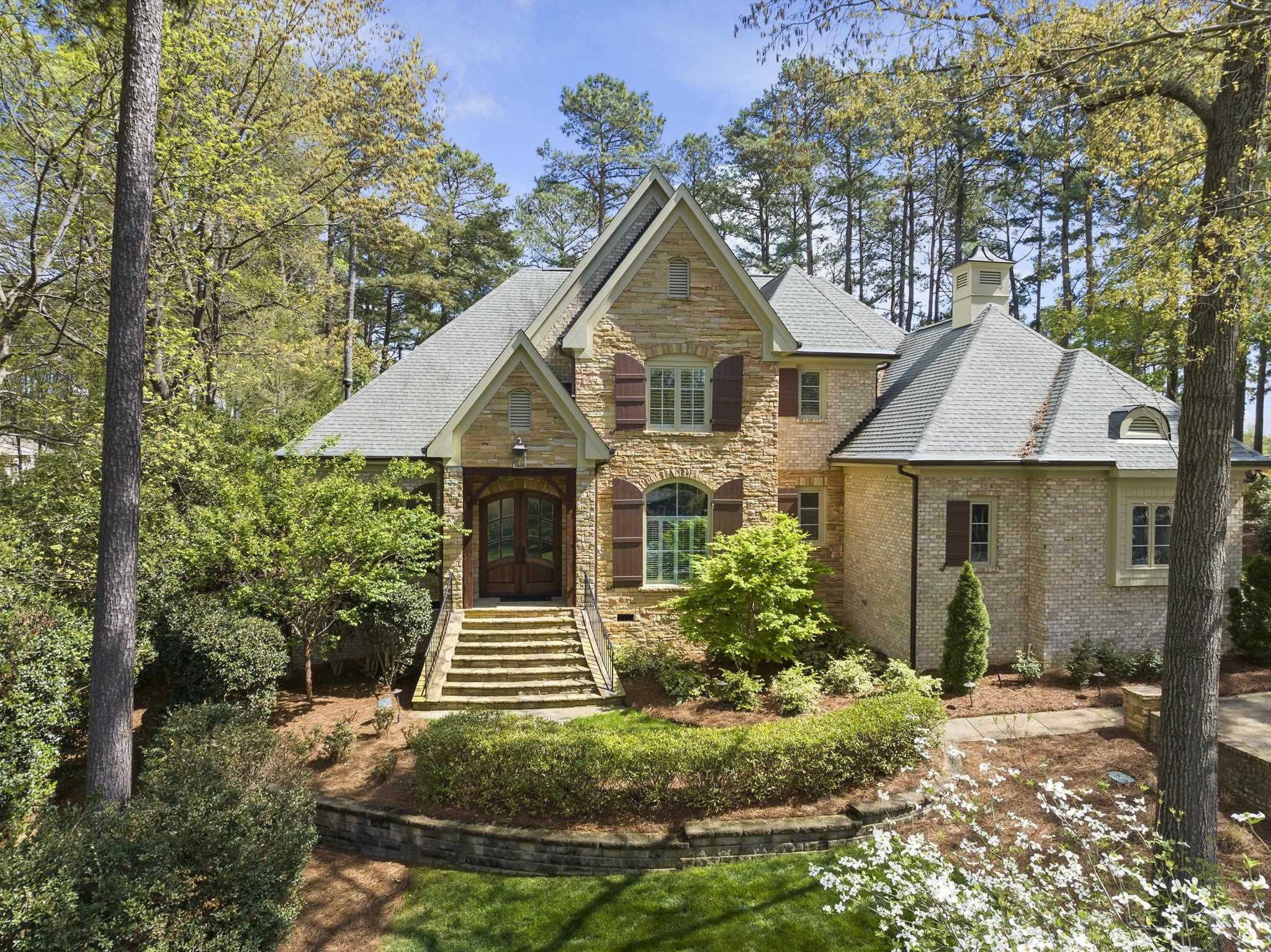 1116 Hunting Ridge Road Raleigh, NC 27615 - Photo 84 of 91 a front view of a house with a yard and trees