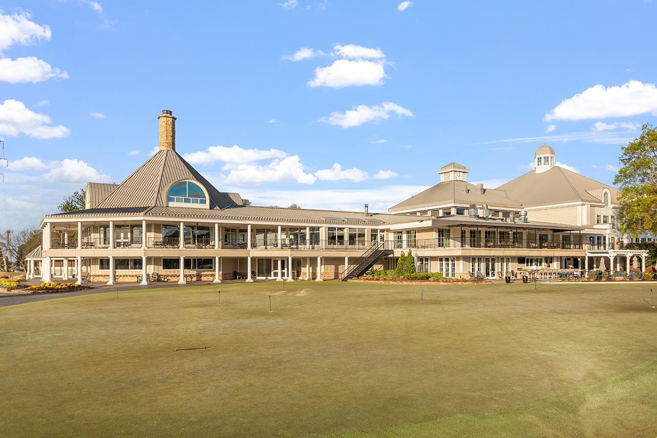 1116 Hunting Ridge Road Raleigh, NC 27615 - Photo 89 of 91 a view of a large building with a big yard and plants