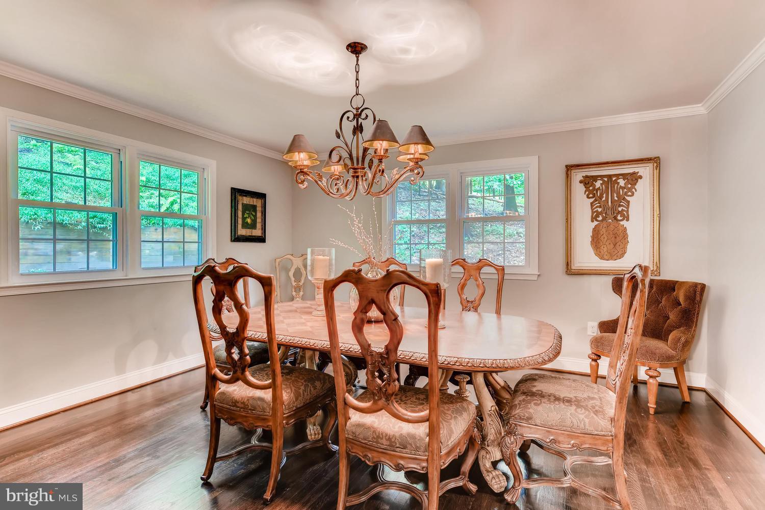 904 Stone Barn Road Towson, MD 21286 - Photo 6 of 30 a dining room with furniture a chandelier and wooden floor