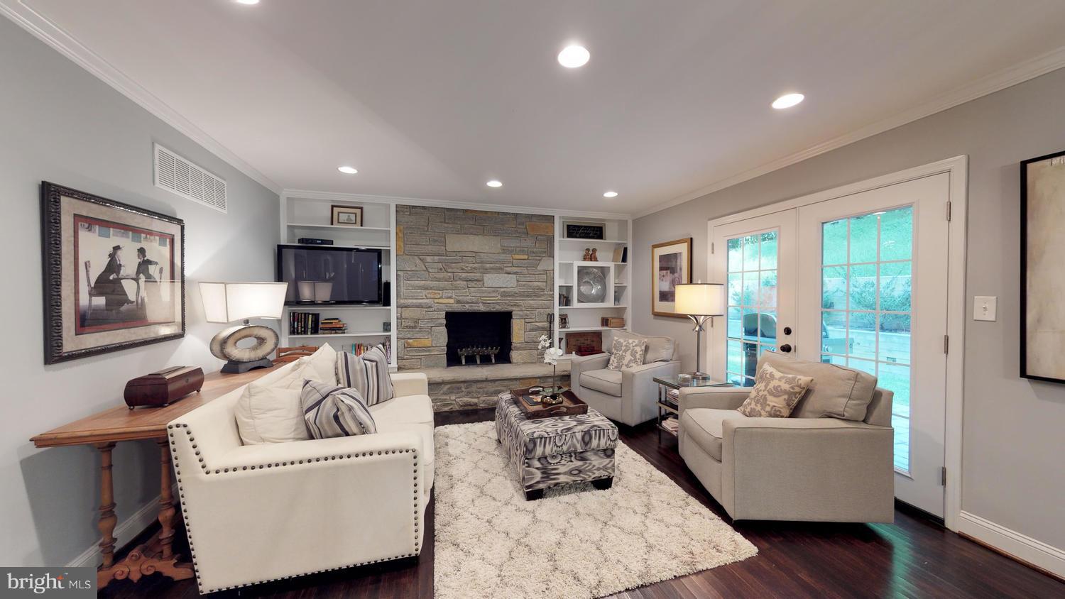 904 Stone Barn Road Towson, MD 21286 - Photo 7 of 30 a living room with furniture and a fireplace