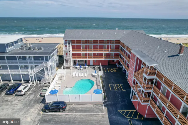 a front view of building with outdoor space and seating