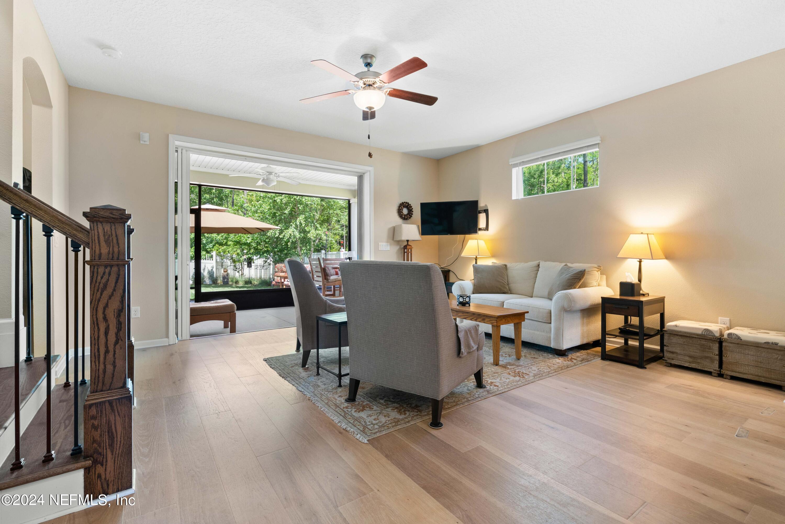 245 Floco Avenue Yulee, FL 32097 - Photo 11 of 38 a living room with furniture and a large window