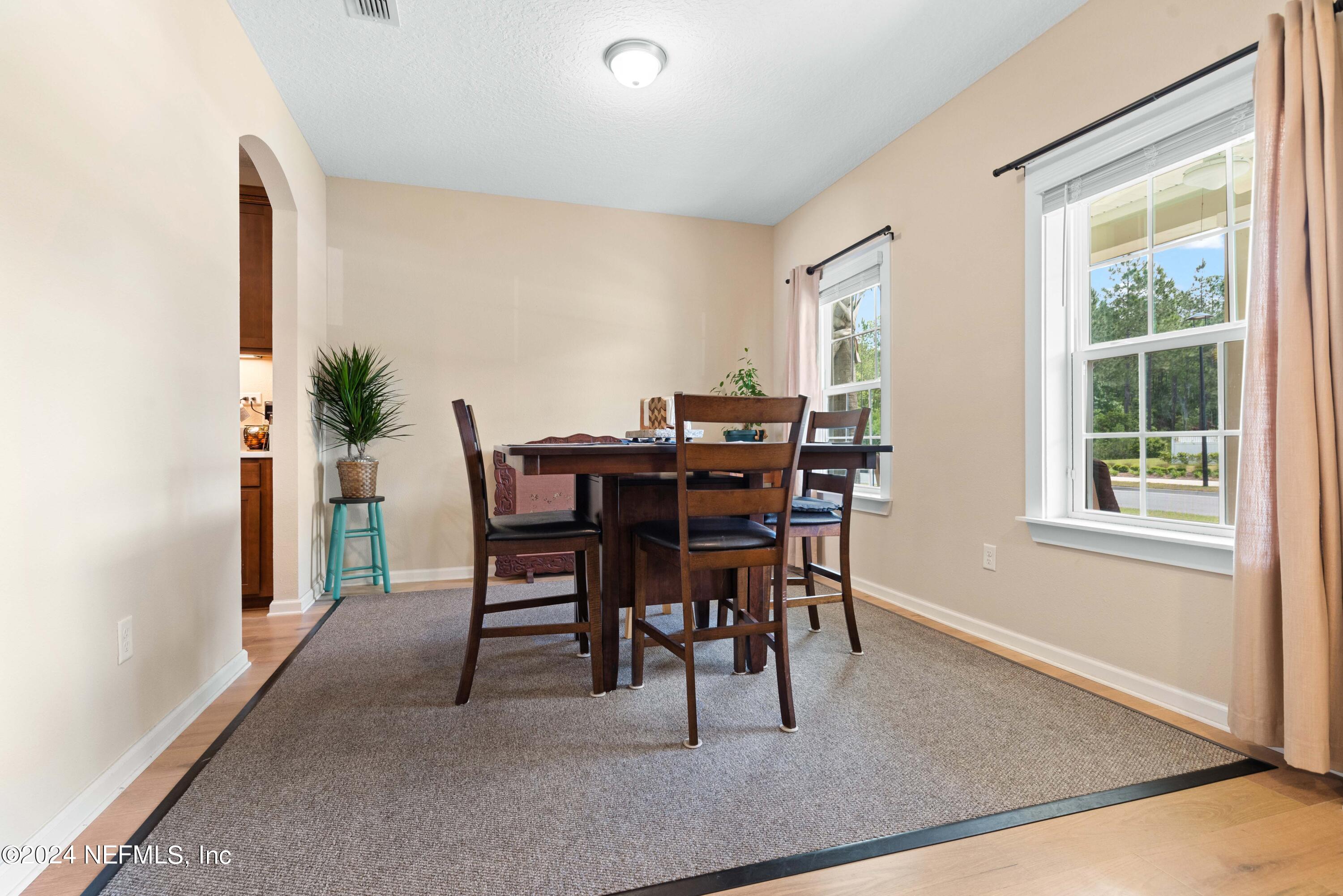 245 Floco Avenue Yulee, FL 32097 - Photo 13 of 38 a dining room with furniture and window