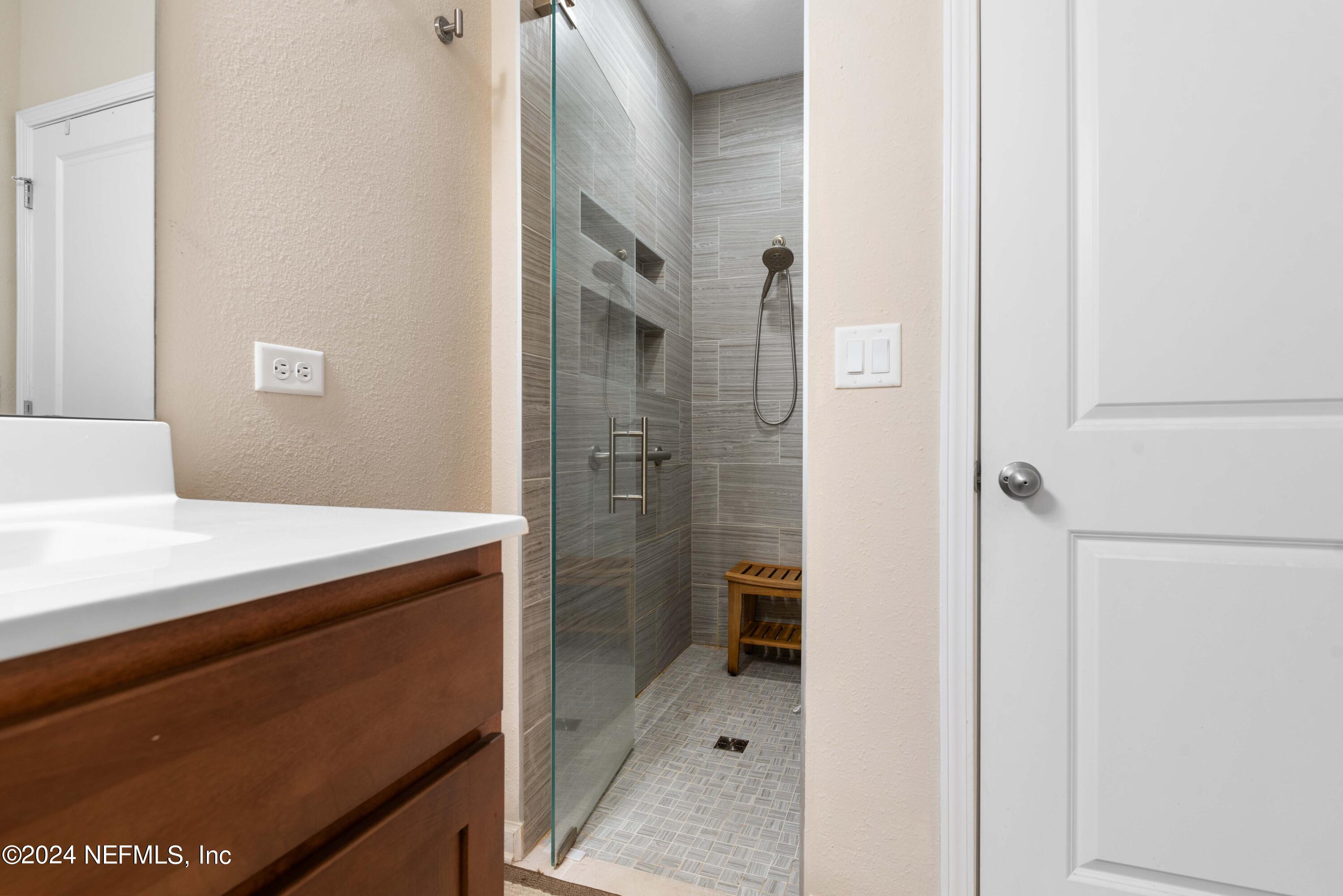 245 Floco Avenue Yulee, FL 32097 - Photo 17 of 38 a bathroom with a shower and a sink