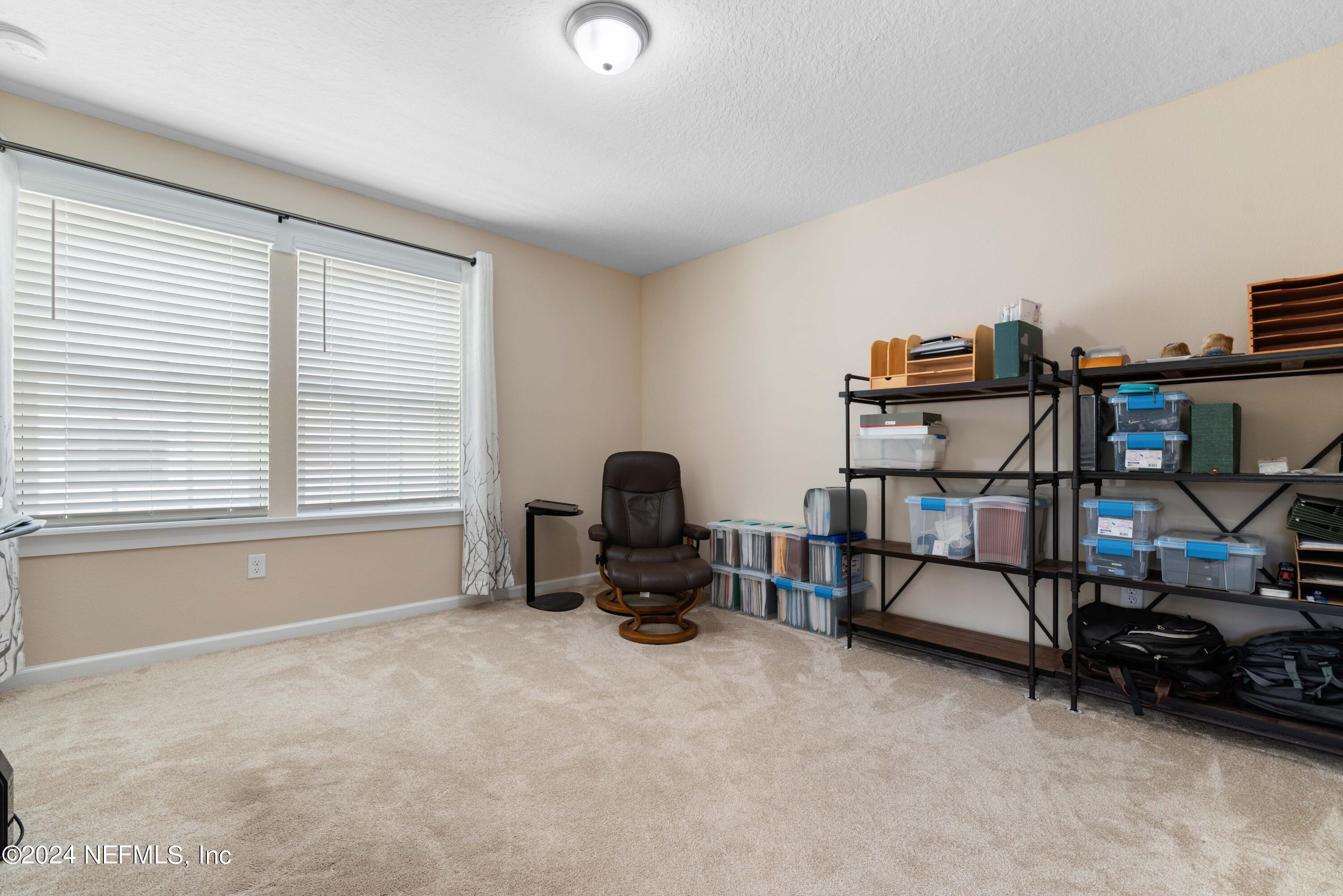 245 Floco Avenue Yulee, FL 32097 - Photo 22 of 38 a view of a workspace with furniture and a window