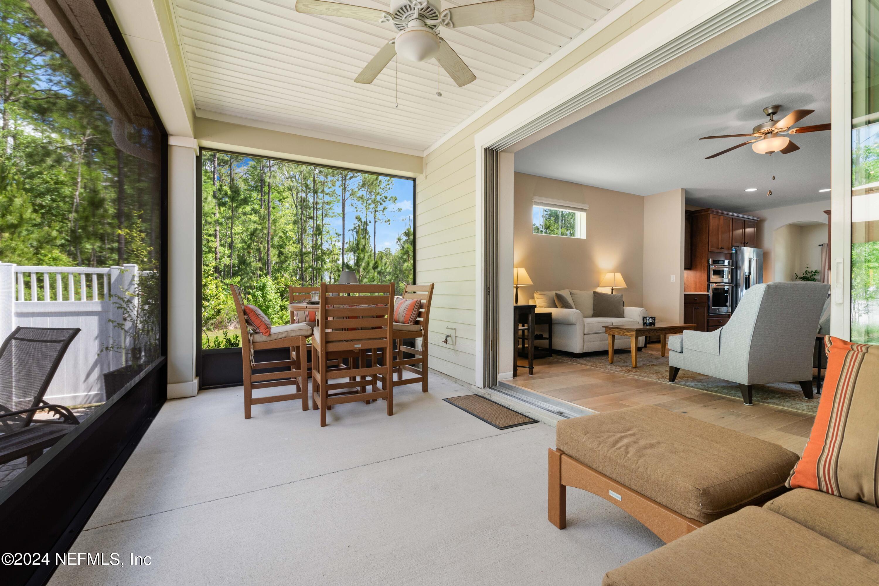 245 Floco Avenue Yulee, FL 32097 - Photo 23 of 38 a living room with furniture and a large window