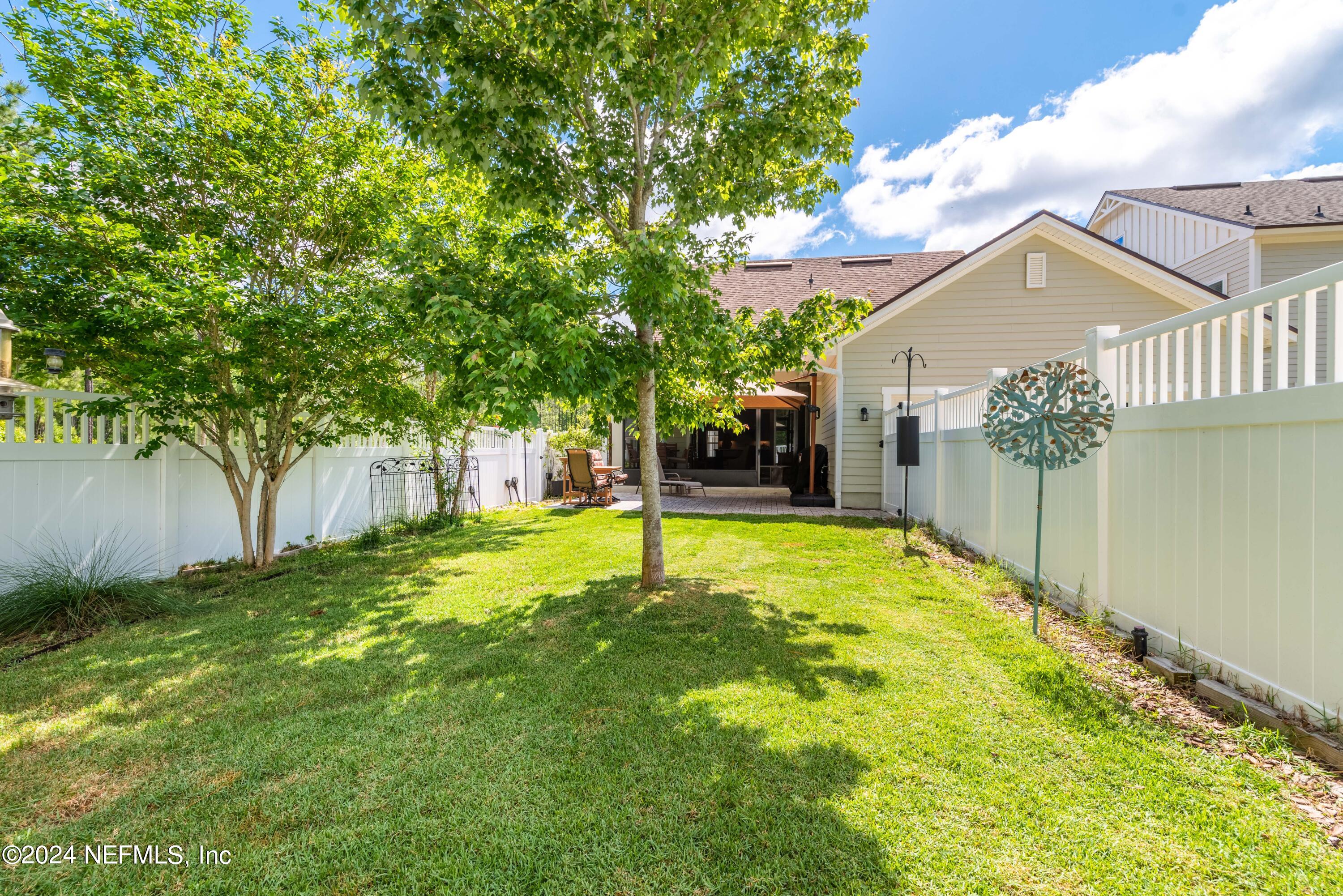 245 Floco Avenue Yulee, FL 32097 - Photo 28 of 38 a house with swimming pool in front of it