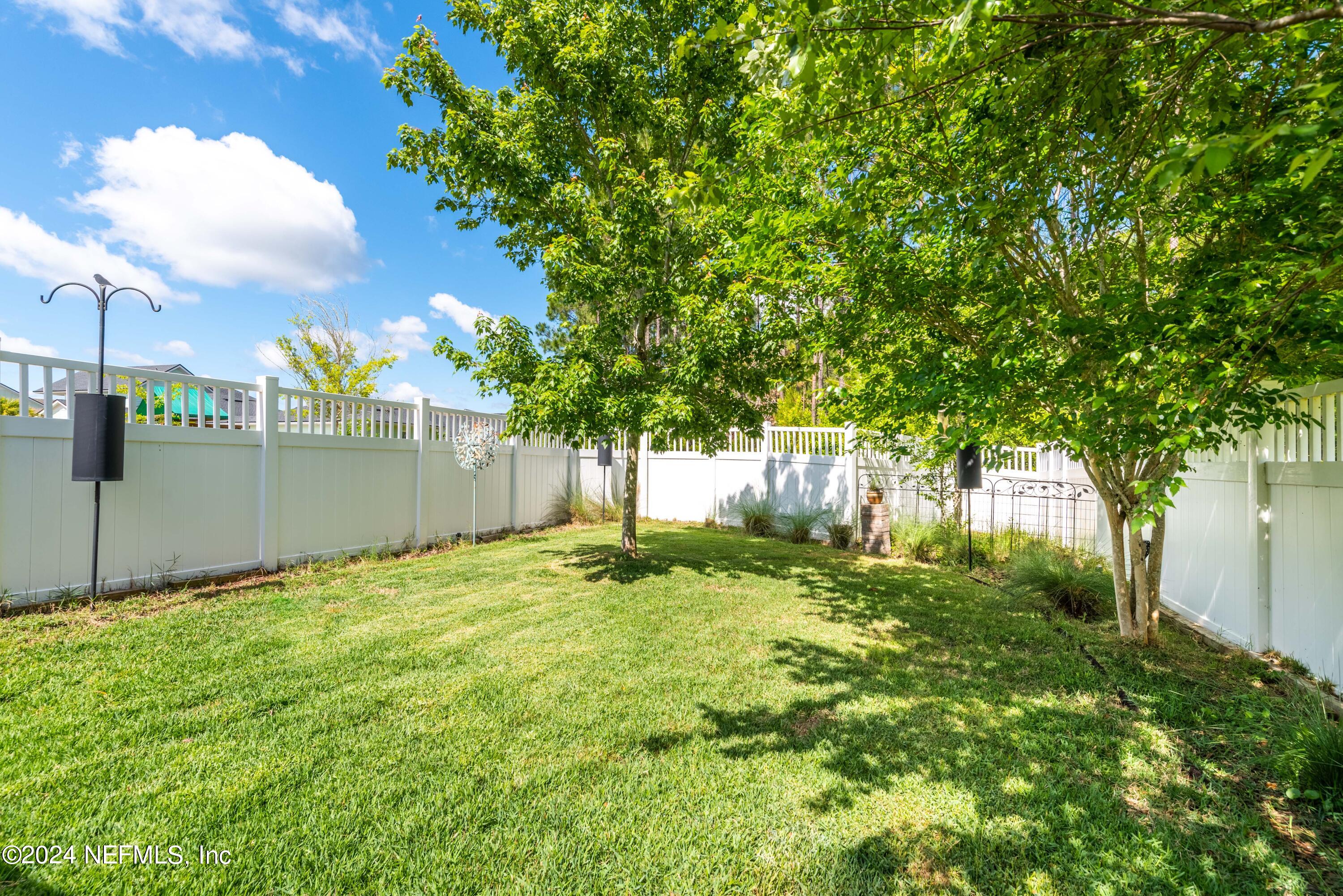 245 Floco Avenue Yulee, FL 32097 - Photo 29 of 38 a view of a backyard