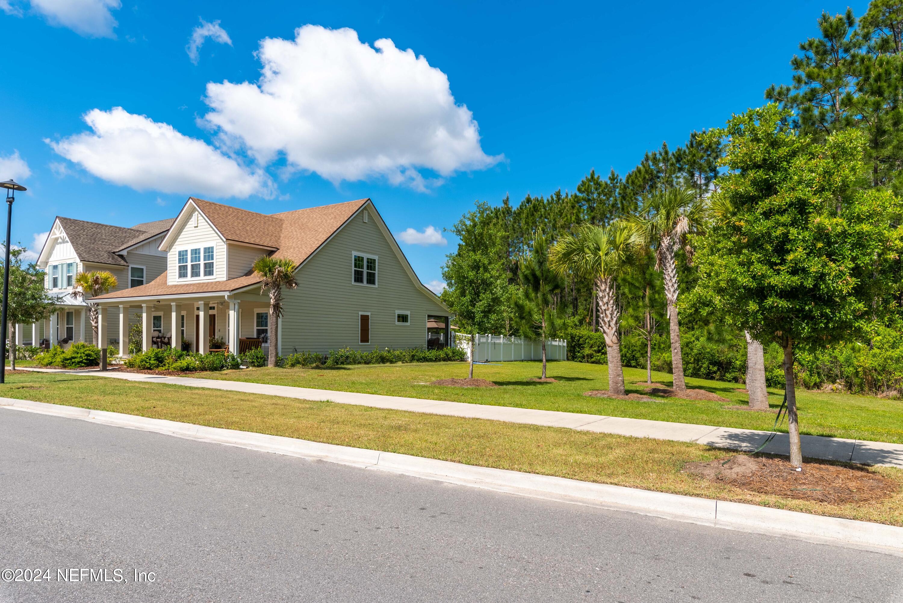 245 Floco Avenue Yulee, FL 32097 - Photo 4 of 38 a front view of a house with a yard