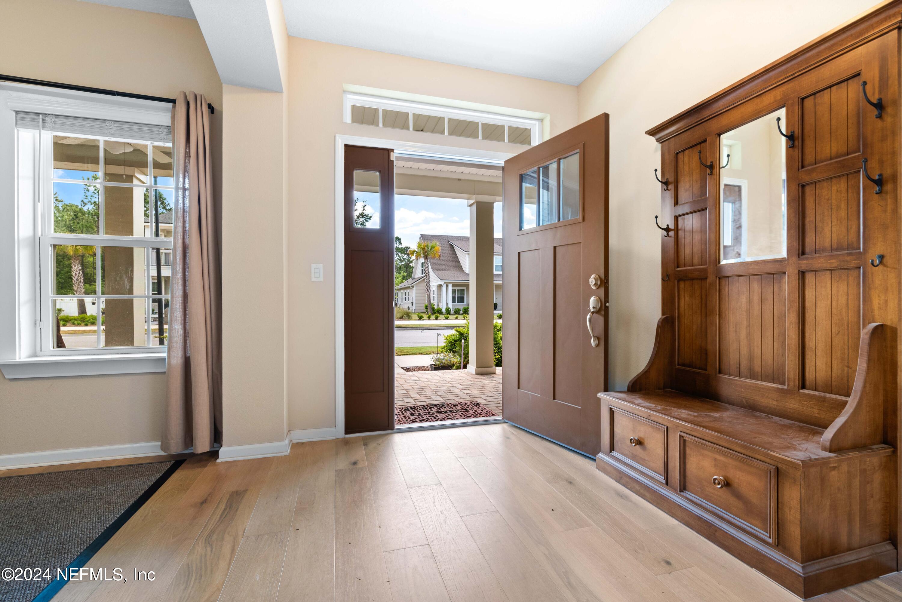 245 Floco Avenue Yulee, FL 32097 - Photo 6 of 38 wooden floor in an empty room with a window