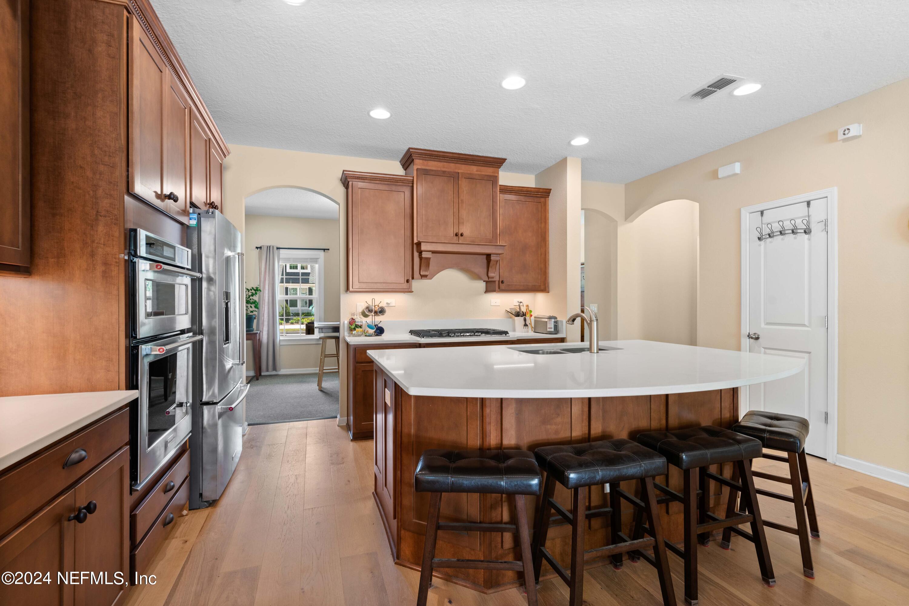 245 Floco Avenue Yulee, FL 32097 - Photo 8 of 38 a large kitchen with a table and chairs
