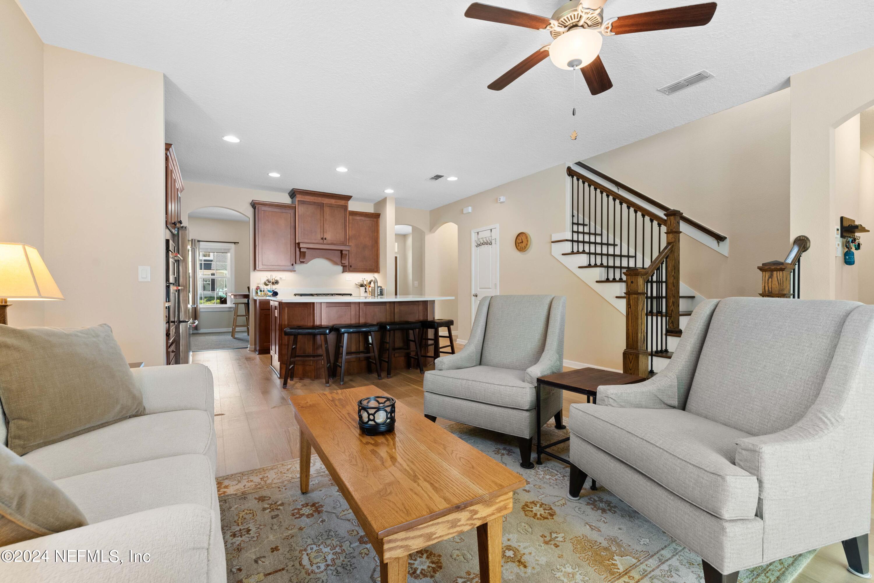 245 Floco Avenue Yulee, FL 32097 - Photo 10 of 38 a living room with furniture and kitchen view
