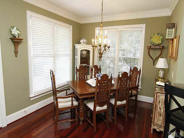 1710 Center Road Raleigh, NC 27608 - Photo 3 of 12 a view of a dining room with furniture window and wooden floor