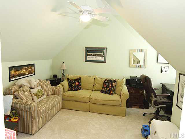 1710 Center Road Raleigh, NC 27608 - Photo 8 of 12 a living room with furniture and a couch