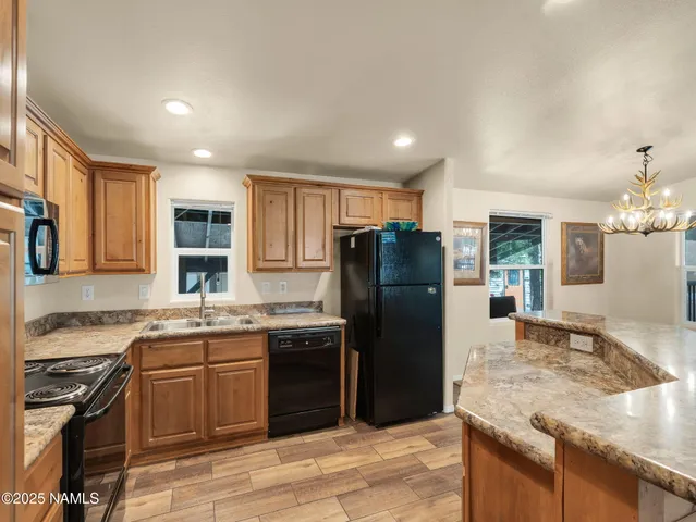 a kitchen with a sink stove and refrigerator
