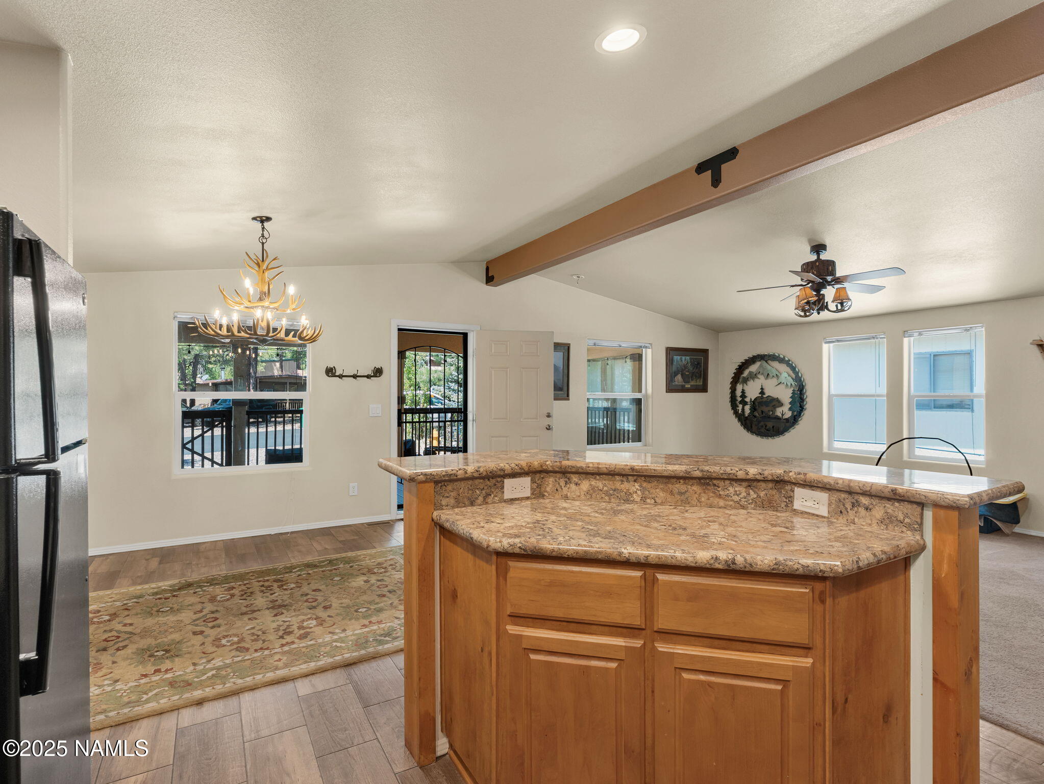 1151 Caribou Road Munds Park, AZ 86017 - Photo 13 of 30 a bathroom with a granite countertop sink and a mirror