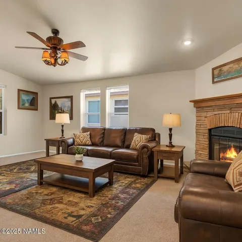 a living room with furniture a lamp and a fireplace