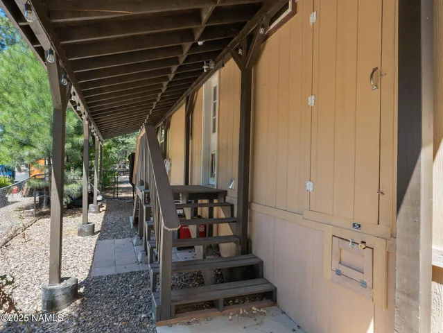 a view of a room with furniture and a chandelier