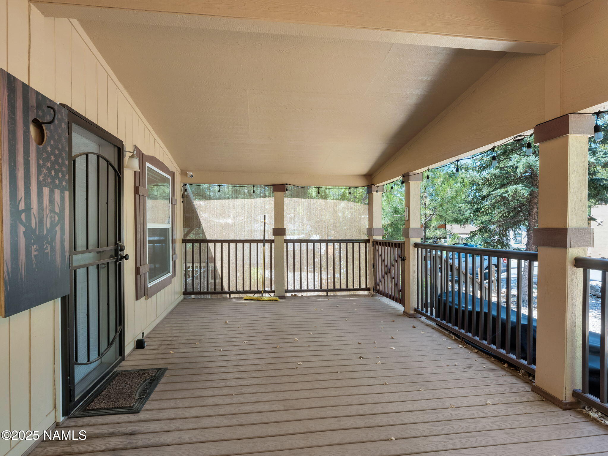 1151 Caribou Road Munds Park, AZ 86017 - Photo 6 of 30 a view of a balcony with wooden floor