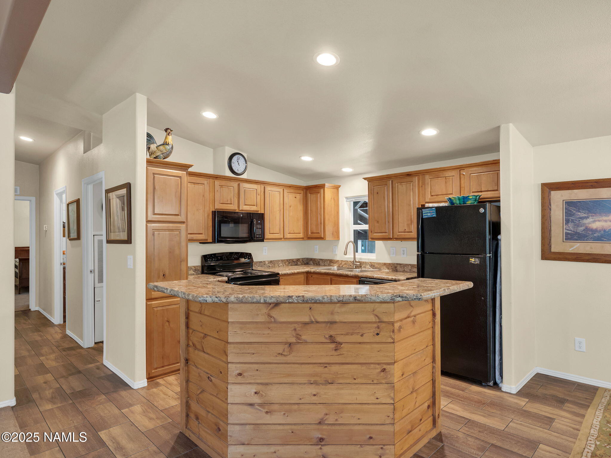 1151 Caribou Road Munds Park, AZ 86017 - Photo 10 of 30 a kitchen with stainless steel appliances granite countertop a refrigerator and a stove