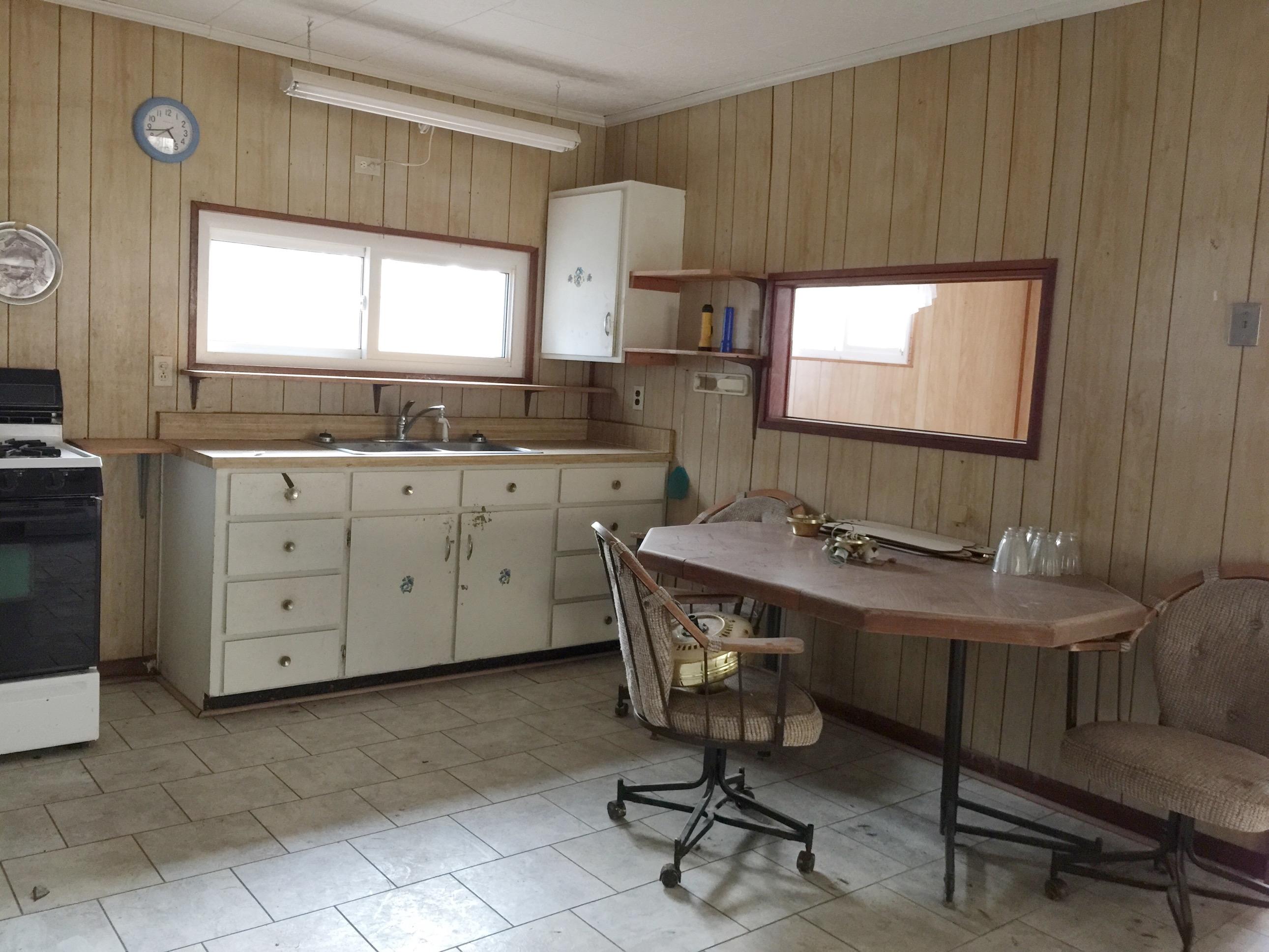 810 Sexton Road DeFuniak Springs, FL 32433 - Photo 2 of 21 a view of a kitchen with granite countertop a sink and a stove