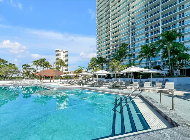 a view of a swimming pool with a patio