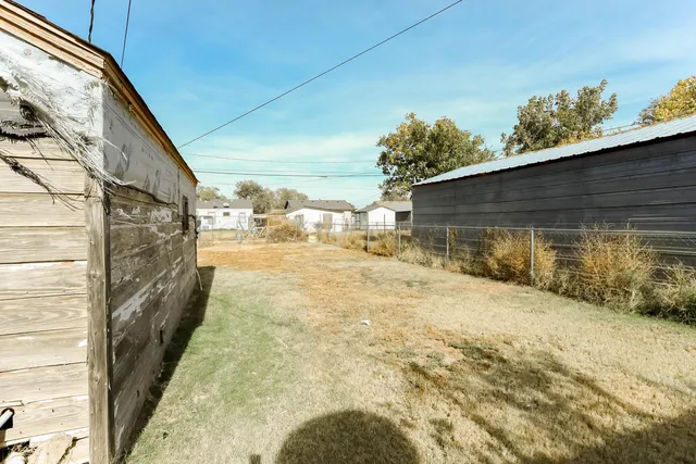 a view of a backyard of the house