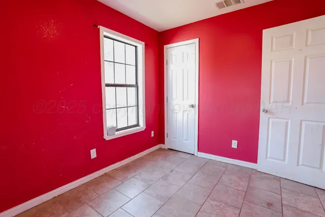 a view of an empty room with window