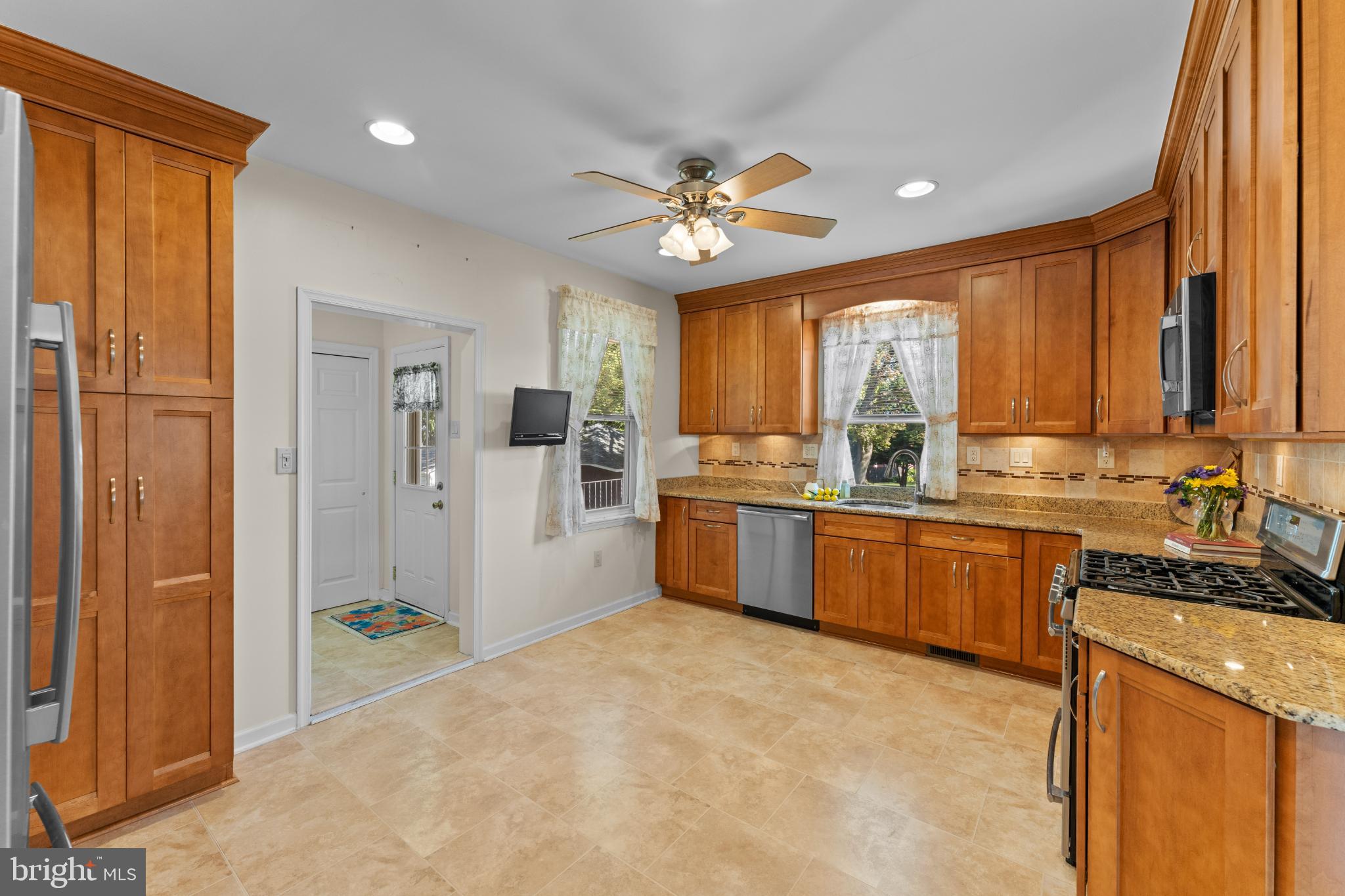 310 Dallas Road Willow Grove, PA 19090 - Photo 11 of 30 a kitchen with a refrigerator a sink and cabinets