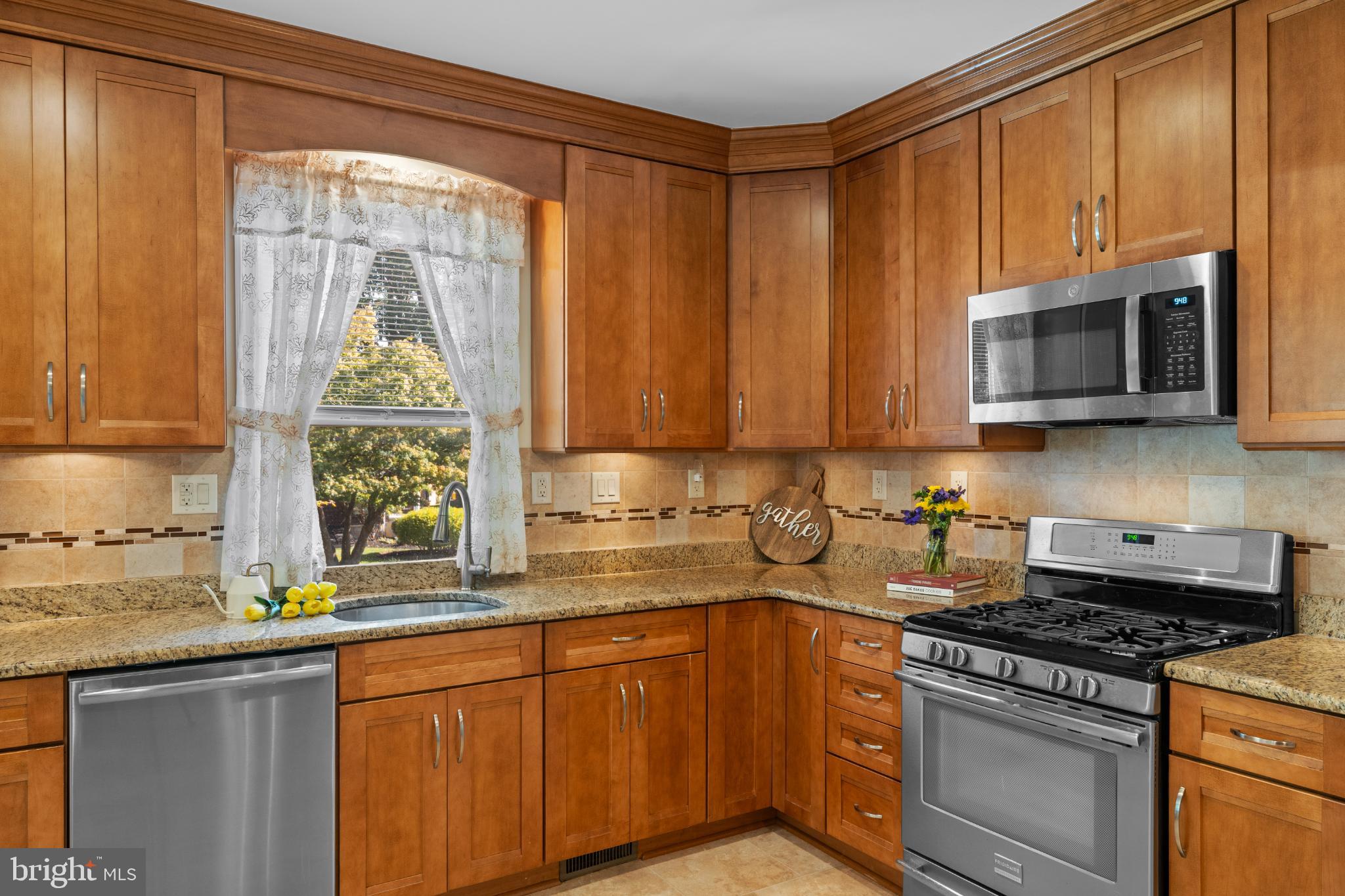 310 Dallas Road Willow Grove, PA 19090 - Photo 12 of 30 a kitchen with stainless steel appliances granite countertop a stove a sink and a microwave