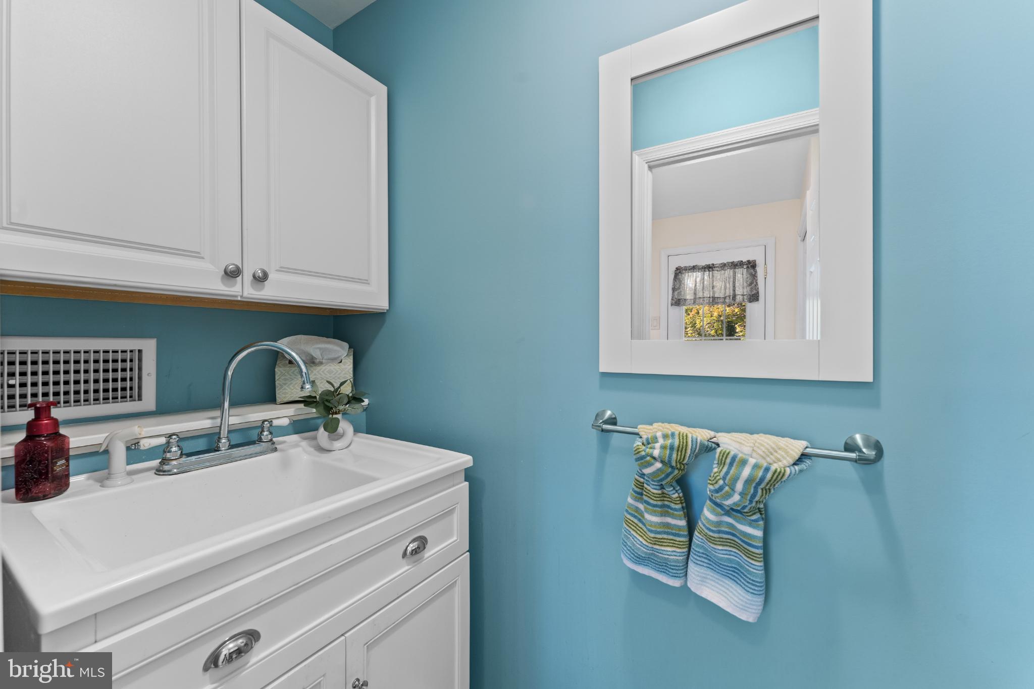 310 Dallas Road Willow Grove, PA 19090 - Photo 15 of 30 a bathroom with a sink and a mirror