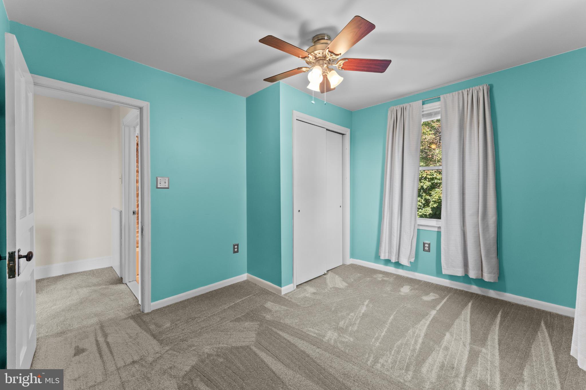 310 Dallas Road Willow Grove, PA 19090 - Photo 19 of 30 a view of a livingroom with a chandelier fan and windows