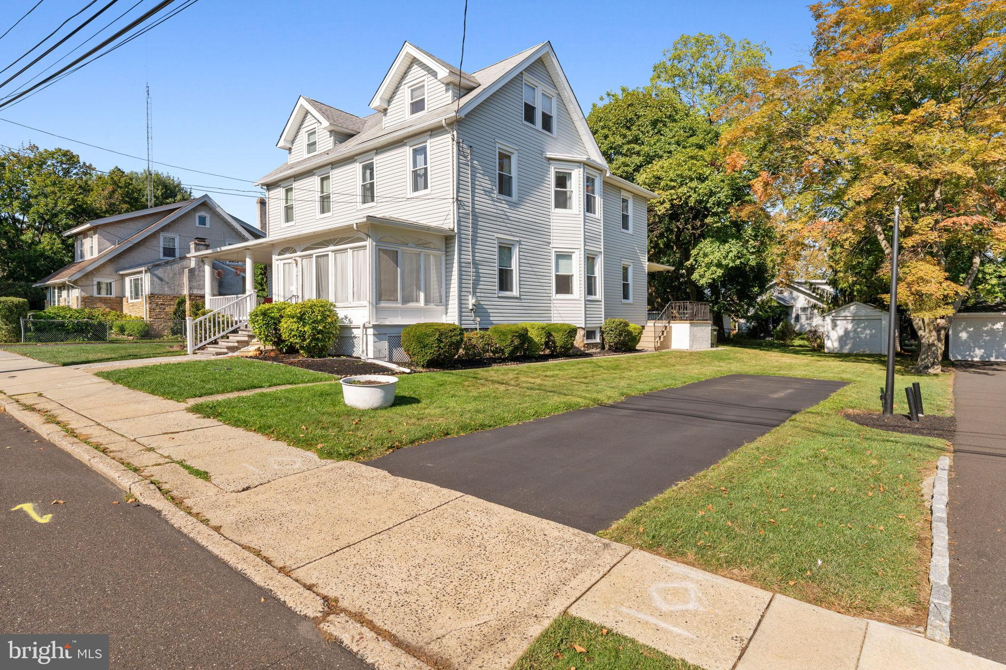 310 Dallas Road Willow Grove, PA 19090 - Photo 2 of 30 a view of a white house next to a yard with big trees
