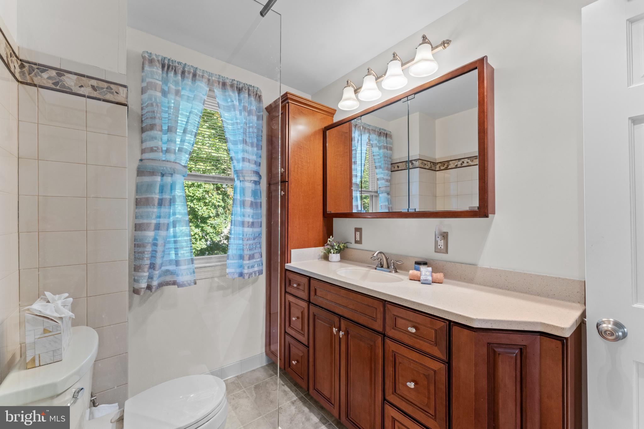 310 Dallas Road Willow Grove, PA 19090 - Photo 21 of 30 a bathroom with a double vanity sink toilet and a mirror