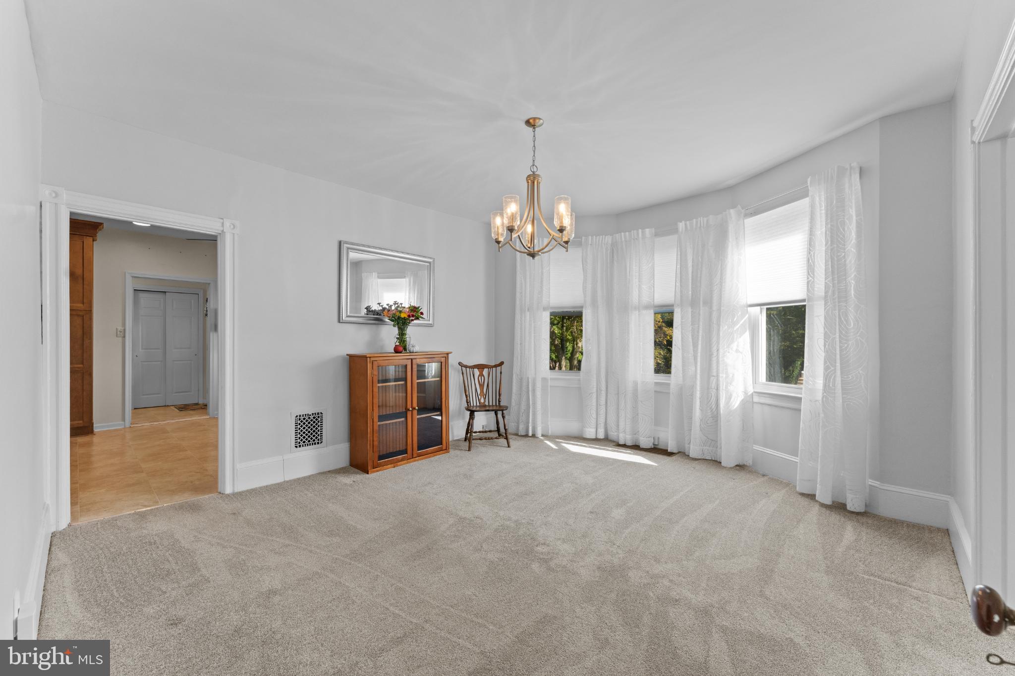 310 Dallas Road Willow Grove, PA 19090 - Photo 9 of 30 a view of a livingroom with a chandelier fan and windows